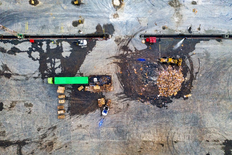A pickup truck loaded with mixed construction debris approaching the Lamb Canyon Landfill scale house in Beaumont, California.